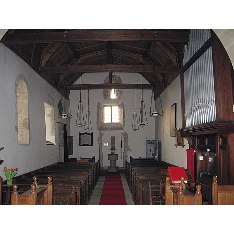 Source caption: "The All Saints' building dates from the 12th Century. This interior view includes the blocked west door."
