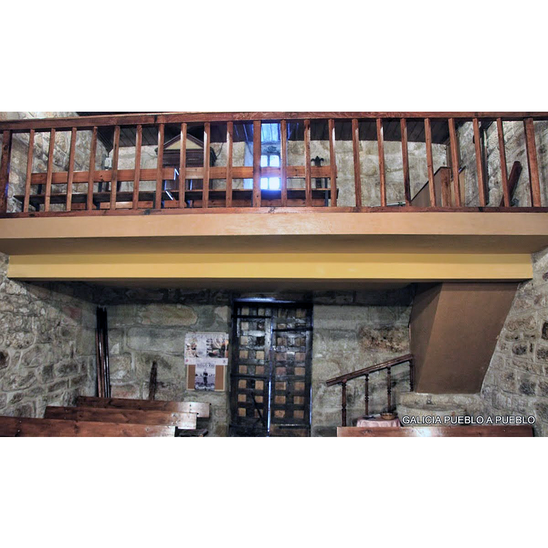 modern galley of the mid-20thC restoration; the font is partially visible in the foreground, right-hand corner, beneath the gallery stairwell
