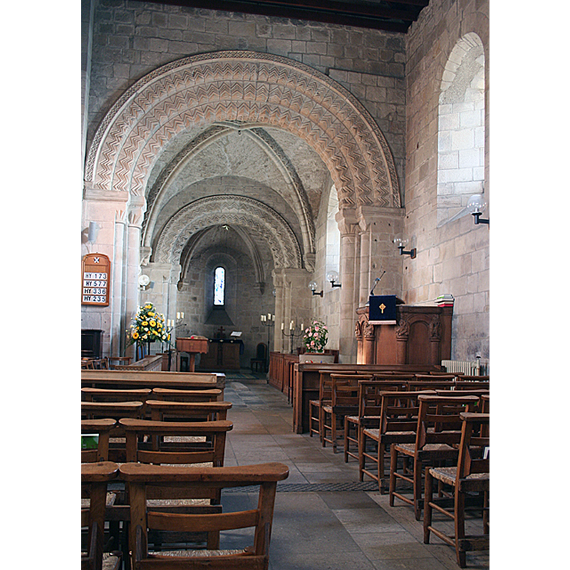 Source caption: "Interior of Dalmeny Kirk. Looking from the nave into the chancel, and into the apse beyond. The arches separating the different parts of the building are decorated with chevrons, and the chancel has ribbed vaulting."