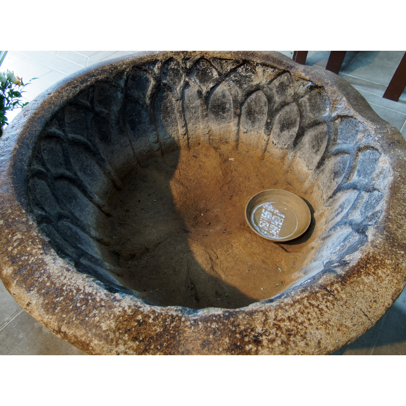 curiously rather less rudely carved than the outside of the basin