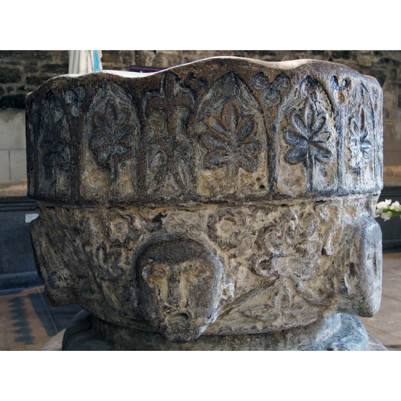 a rather awkward-looking one, breaking the pattern of ponted arches filled with oak leaves