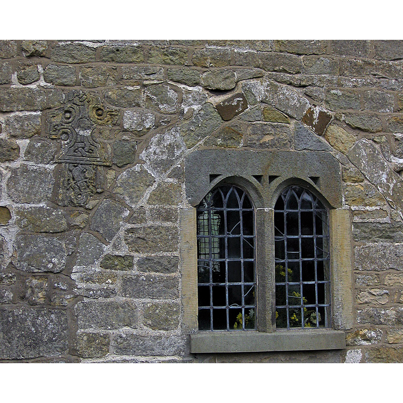 Source caption: "The nave and chancel date from the 11th century. Fragments of pre-Conquest stonework are incorporated into the south walls of the nave and chancel."