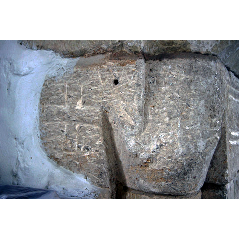 Source caption: "One of the chancel arch capitals has a cross inscribed."