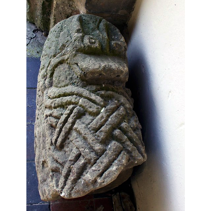 Source caption: "A hogback tombstone with interlace and a bear biting into it. Dating from the Anglo-Danish period. Could this be the tomb of a warrior that helped create "Danes Dike" an earthen bank & ditch that divides Flamborough Head from Bridlington, less than 6 miles away."