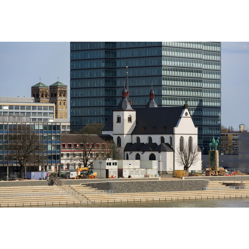Source caption: "Cologne, Germany: Alt St. Heribert in front of MaxCologne" -- the twin towers in the background are those of the late-19thC Pfarrkirche Neu St. Heribert