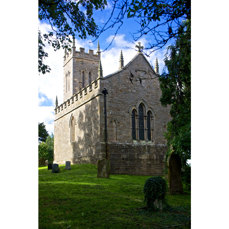 Source caption: "The church was built in 1834 [...] Stone from the old church was used in the construction of the new building."
