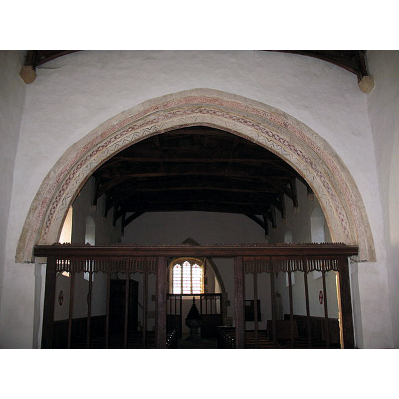with a view of the west side of the chancel arch and its 15thC (?) painted archivolt -- the baptismal font is visible through the screen, at the far back
