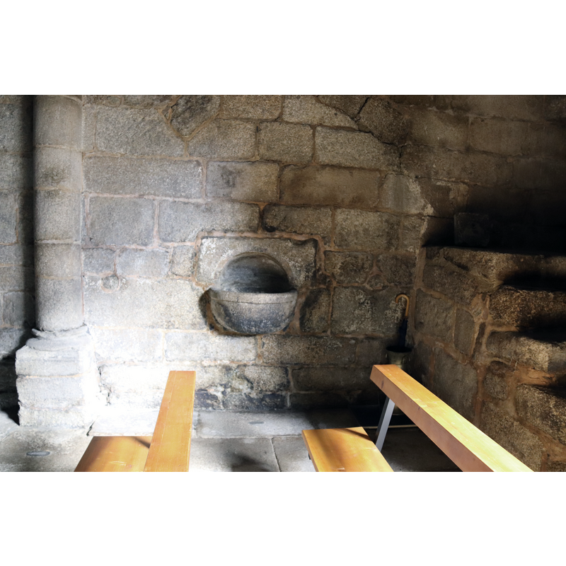 this stoup probably belongs to the original church here, as it is close to the entranceway