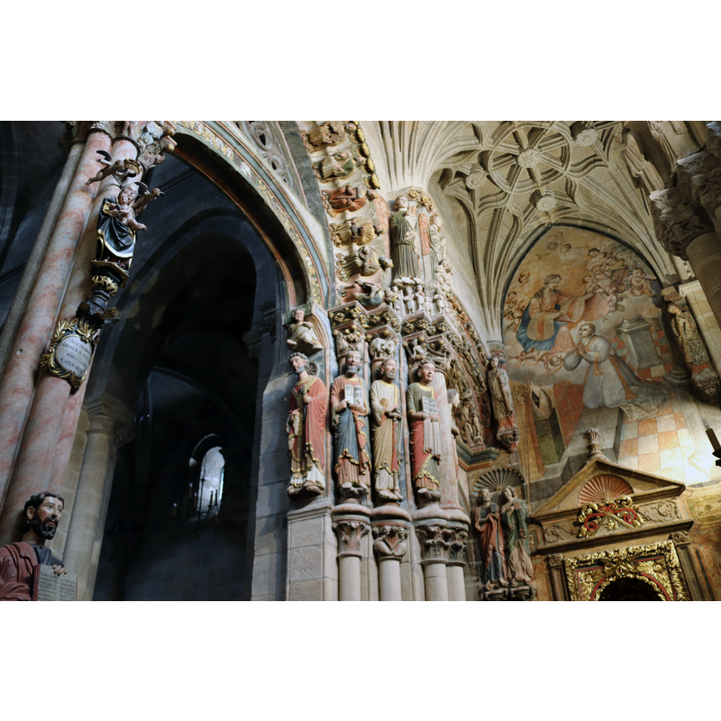 "monumental puerta del oeste (conocida como Pórtico del Paraíso) la más espectacular y llamativa de las entradas a la seo orensana, gracias a sus más que respetables dimensiones, a su enorme colección de estatuas pétreas y a los restos de policromía que conserva" [www.arteguias.com/catedral/orense.htm] [accessed 14 December 2019]
