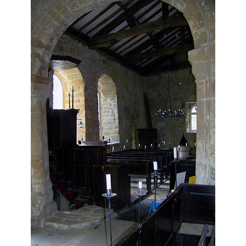 Source caption: "Interior of All Saints Church, Great Ayton. The candlelit interior contains mainly 18th century furnishings including a three decker pulpit and sounding board."