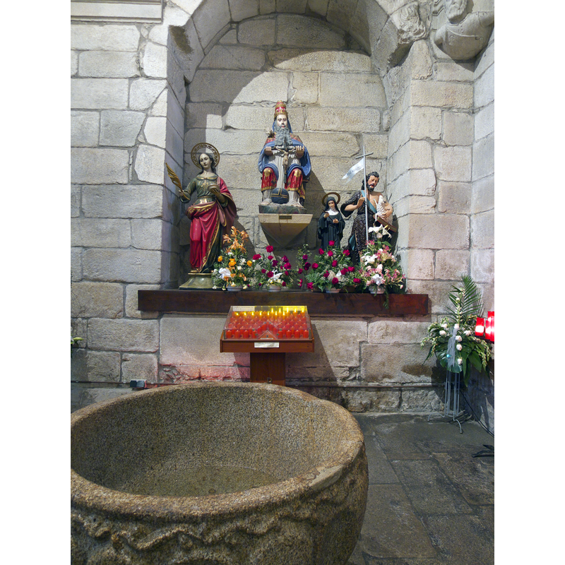 a partial view of the font in its location inside the church, the Capilla de Valderrama