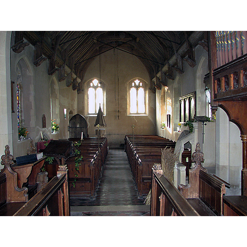 with the font and cover at the far end, by the south doorway