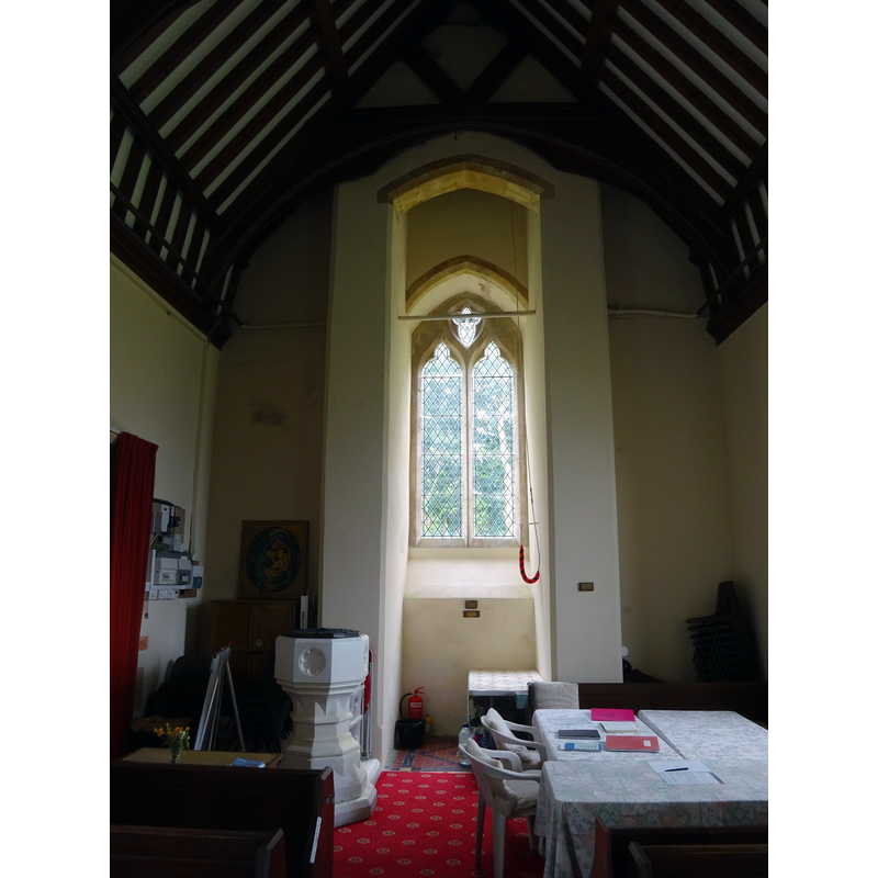 the modern font at the west end of the nave -- the present church is a mid-19thC re-building on a site near the disappeared medieval church demolished ca. 1800 [cf. FontNotes]