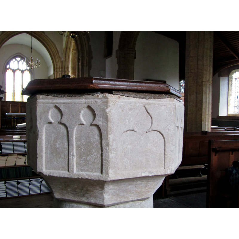 in pairs on four of the eight faces of the octagonal basin -- all of them appear to have been re-tooled