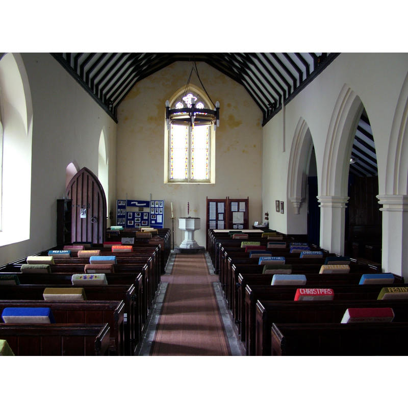 with the modern font at the far end of the centre aisle