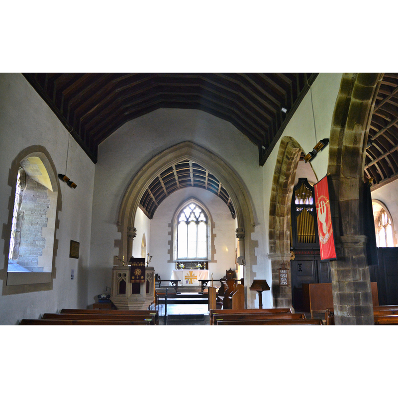 Source caption: "St Paulinus, Llangors. The interior, showing the chancel arch installed by Thomas Nicholson in the 1873-5 'restoration'."