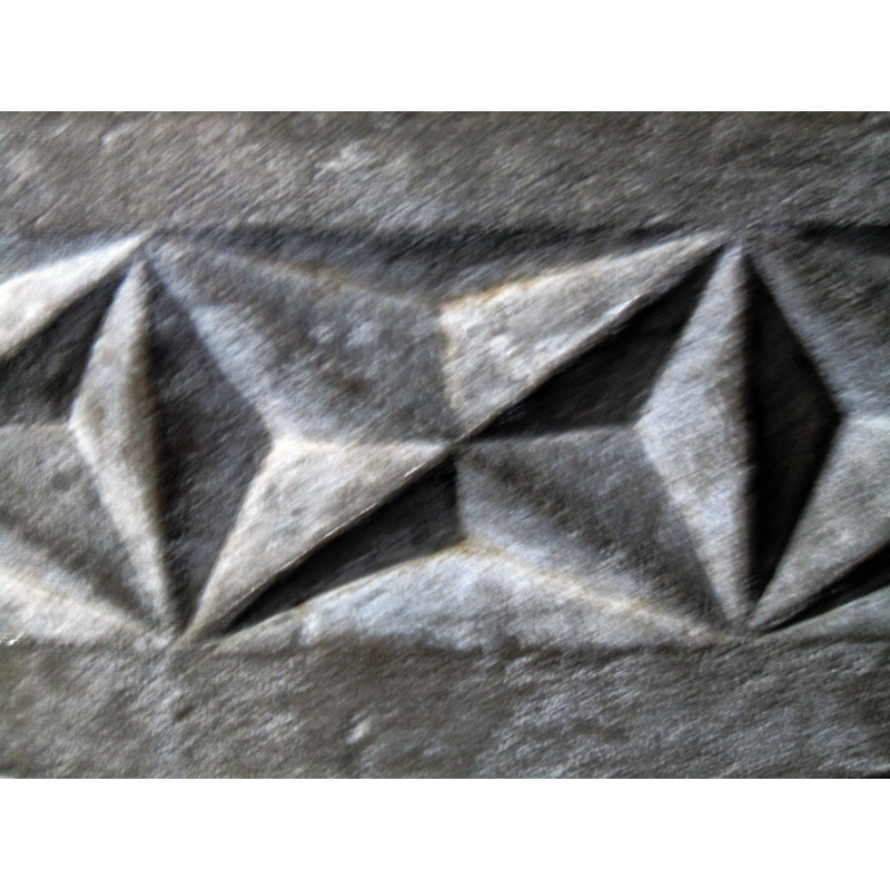 a detail of the carving in the re-tooled or replaced area of the basin, the southwest side, near the upper rim