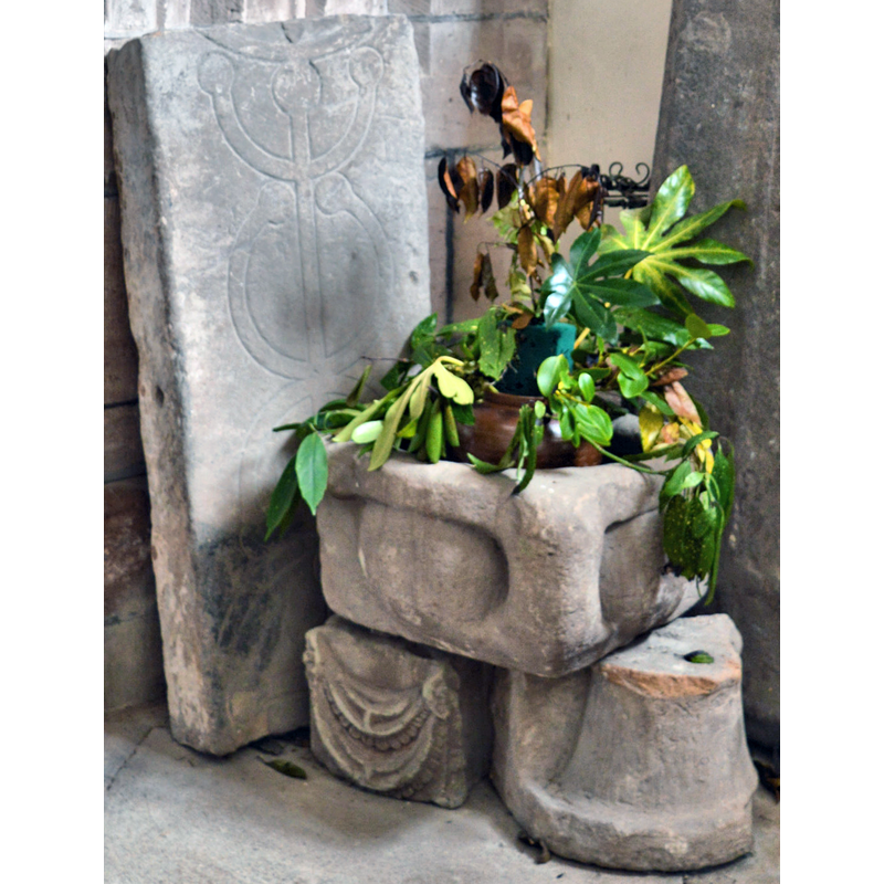 the square stone basin could be a font, a stoup or a medieval grain measure [cf. FontNotes]