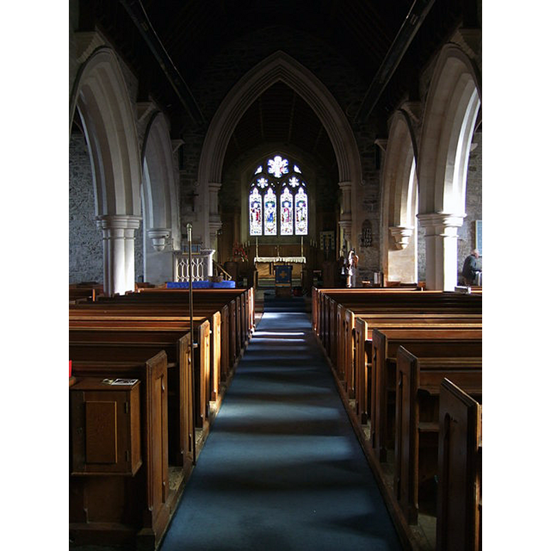 Source caption: "Trefdraeth/Newport church interior. Looking down the nave towards the chancel here, the two-bay arcades can be seen across the transepts of this fine, large, cruciform church. The church was originally Norman but more or less completely rebuilt in the C19."