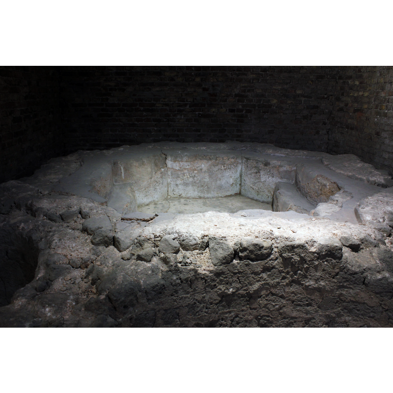 ruins of the baptismal font from a free-standing 7th-century baptistery existed in what is now the east end of the cathedral; the baptistery itself was demolished in the 9th century