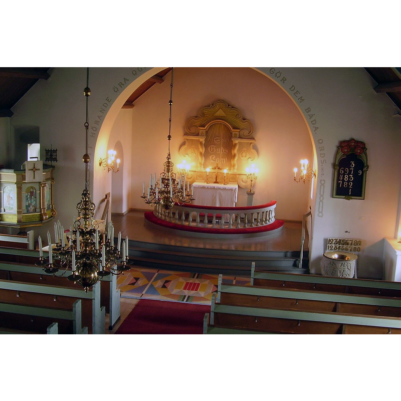 the new Härjevads kyrka, built in 1921 near the site of the medieval church -- notice the medieval baptismal font from the old church seen here in the southeast corner of the nave
