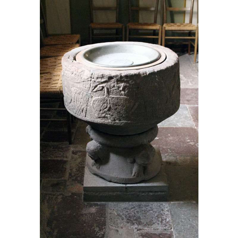 the basin programme is very worn and its details very hard to discern -- a couchant animal in the centre arch here