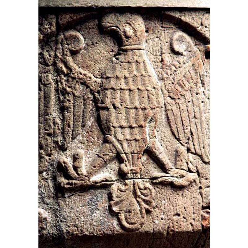 a heraldic eagle? -- notice the damage to the surface, a vertical crack, on the left wing