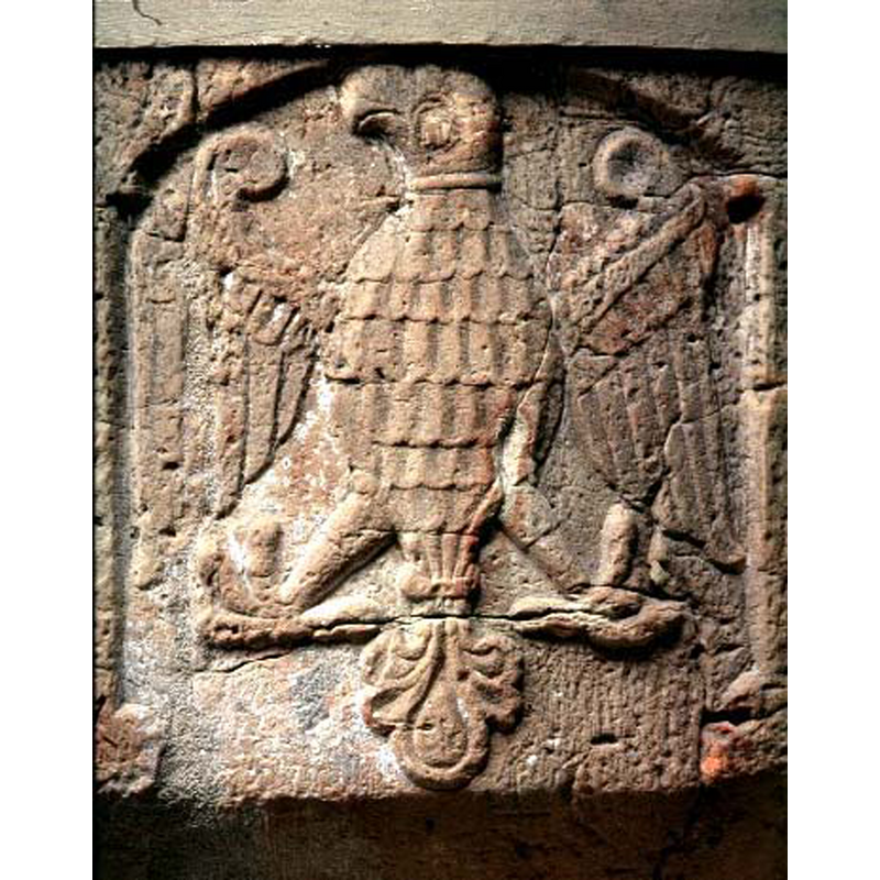 a heraldic eagle? - notice the damage to the surface, a vertical crack, on the left wing, repaired here