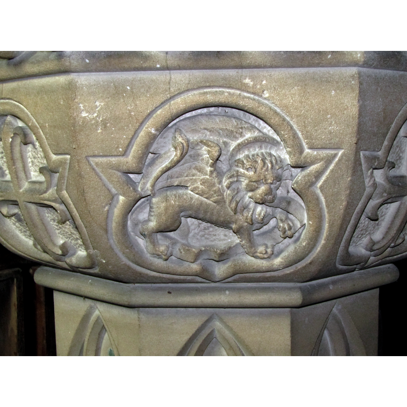 cusped frame shows a haloed winged lion holding a scroll: Mark's symbol on a side of the modern font
