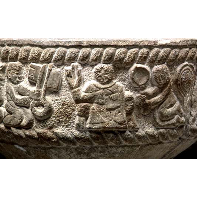 this could be a scene of the chaging of the keys: Peter kneeling on the left holding a large key; Christ in the centre with right hand raised in benediction, left hand holding a book on his lap; an angel holding an object kneels on the right
