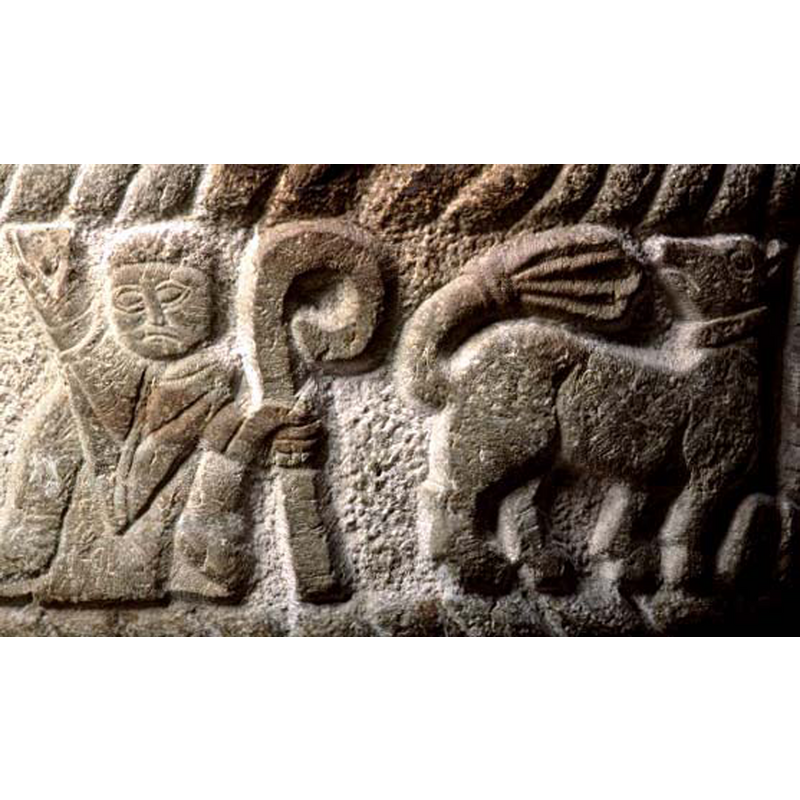 seen ehere to the right of the cleric; although the animal has a fanned tail often related to a lion, the head, collar on its neck and paws suggest a dog