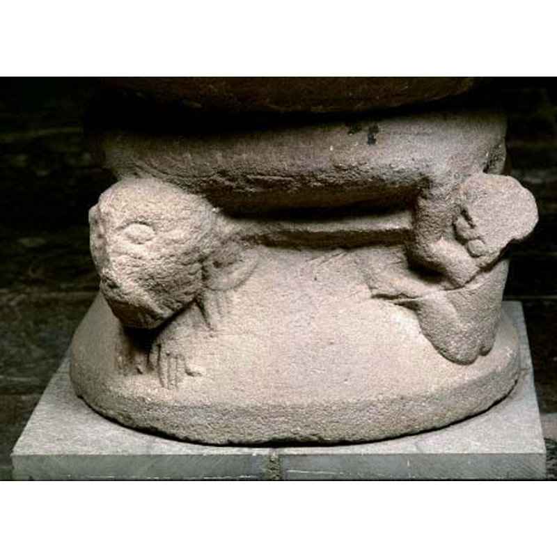 seen here on the right, perhaps simian? its front paws hold the roll moulding, as if it were climbing up