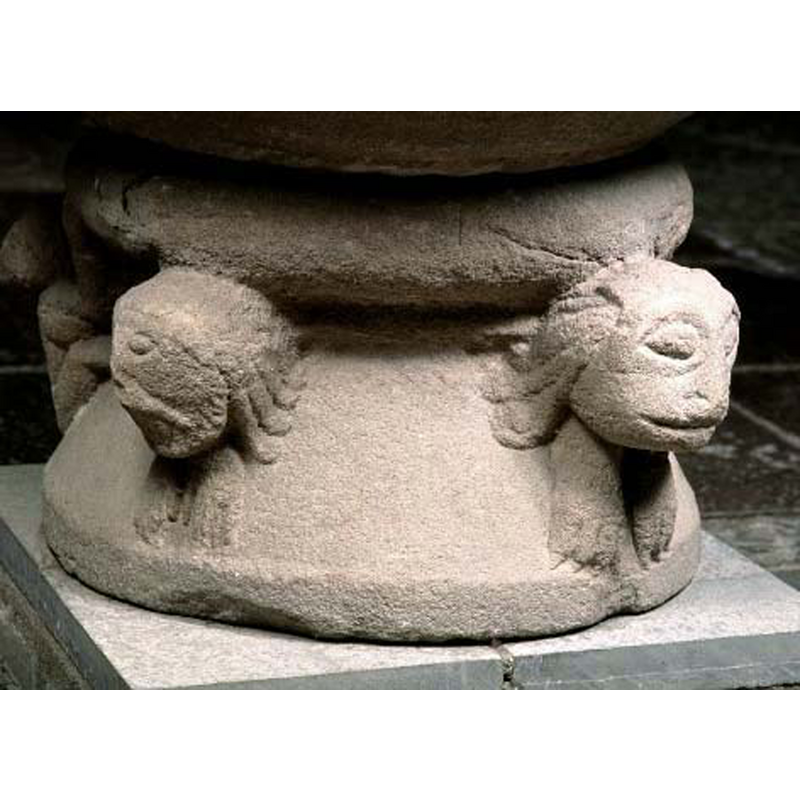 with three pf the figures visible here; the one on the extreme left, possibly simian, appars to climb up to the roll moulding