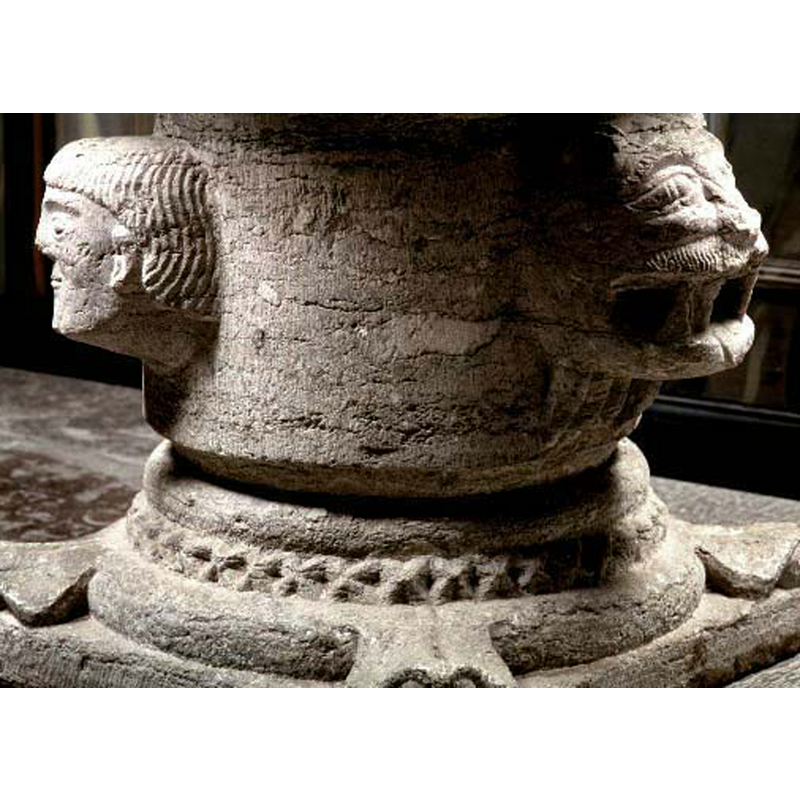 human and lion heads; roll mouldings enclosing band of dog-tooth pattern; leaves at corners