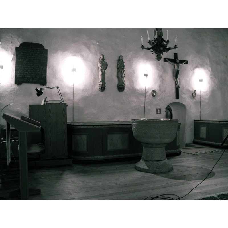 with the north wall and the sacristy doorway in the background