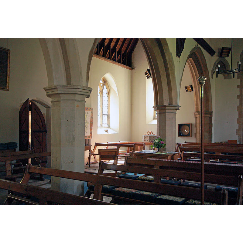 the modern font is visible in the left [south] aisle, through the second arch of the arcade