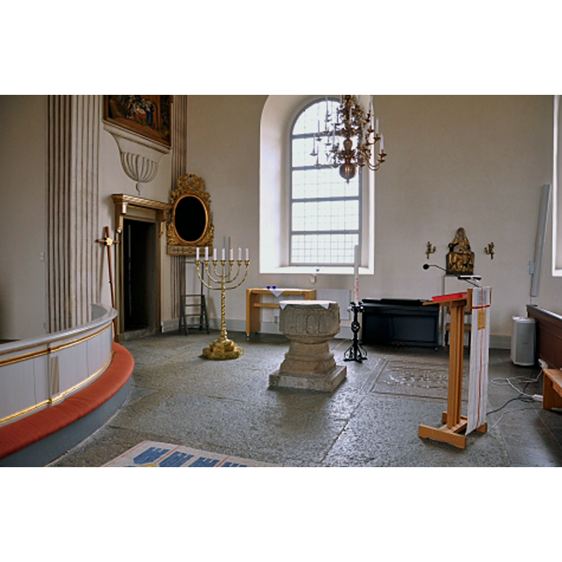 the medieval font in the context of the chancel of the new church