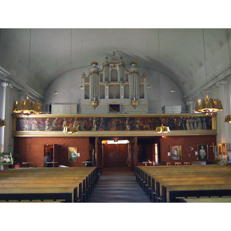 the top of the medieval font is discernible at the far [west] end, right [north] side