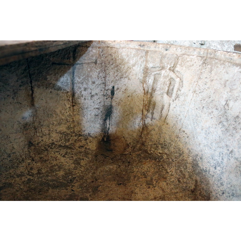 two such are seen here to the left of the carved human figure; are they original? added later?