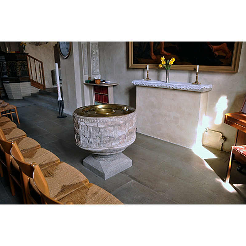 the medieval font now at the east end of the nave, south side, across the nave from the pulpit