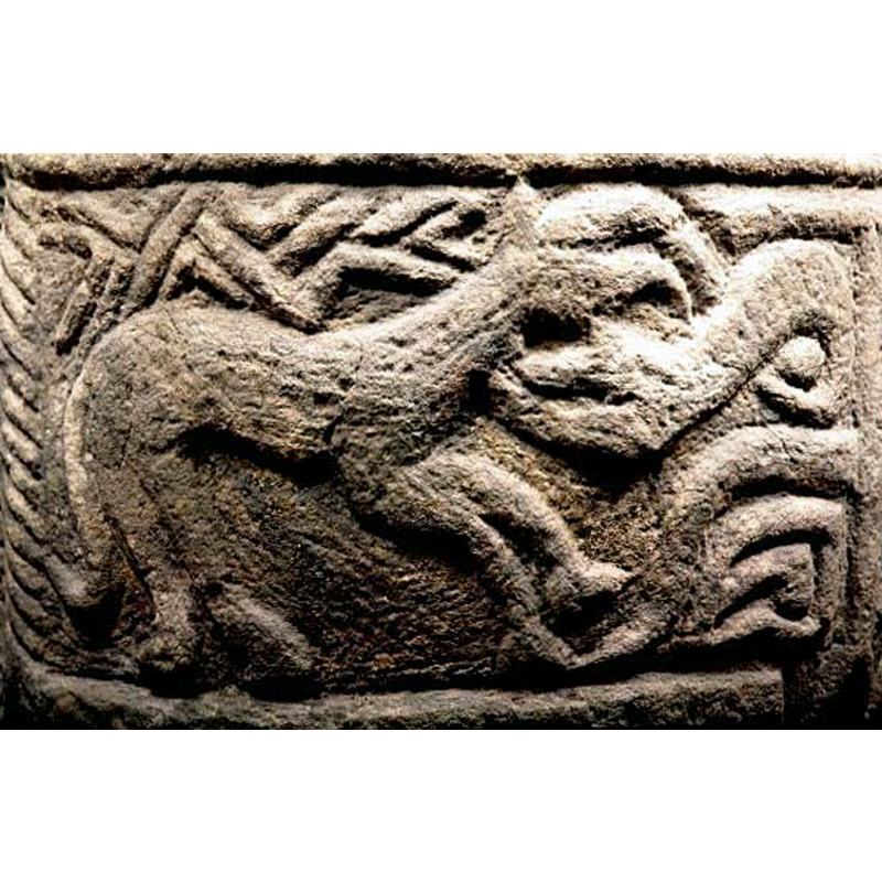 the scene appears to be a zoomachia: the quadruped on the legt and the reptile on the right appear to be at each other's necks -- chevrons(?) fill the space above the quadruped