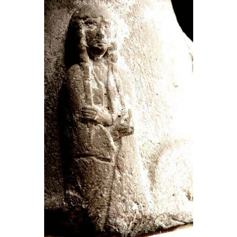 the hands appear to hold both the ends of her long braids and the sides on the long mantle