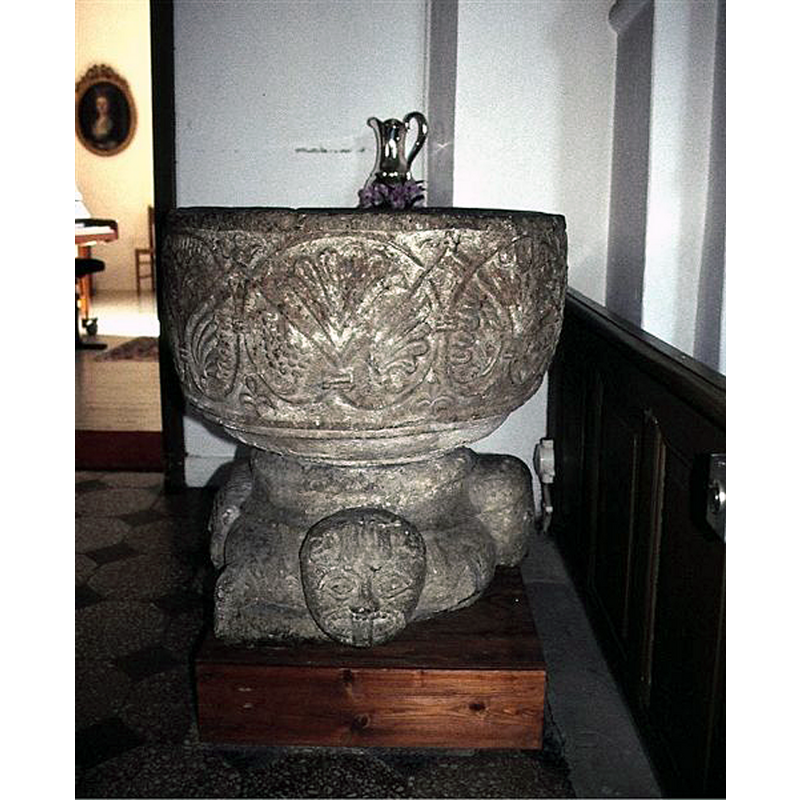 the font displayed inside the church after its return from the SHM