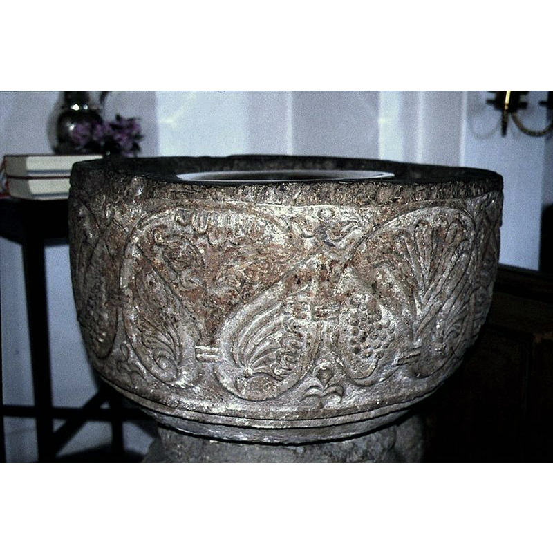 the font displayed inside the church after its return from the SHM