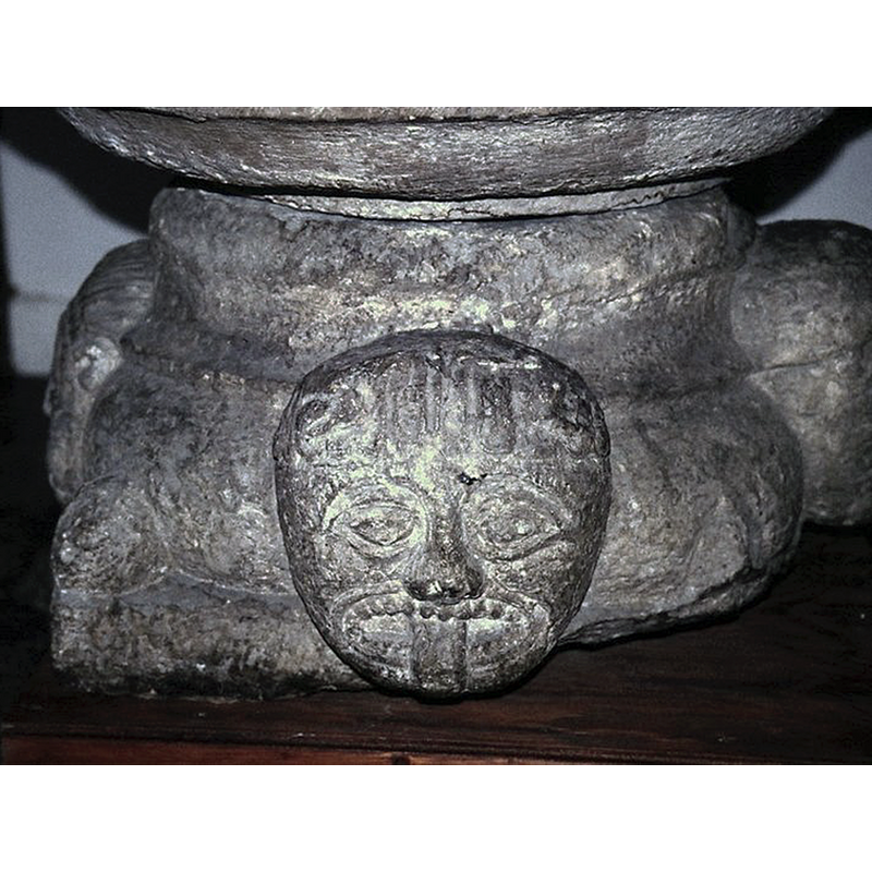 the font displayed inside the church after its return from the SHM