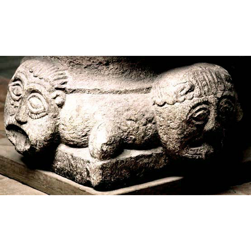 shown here between two of the heads