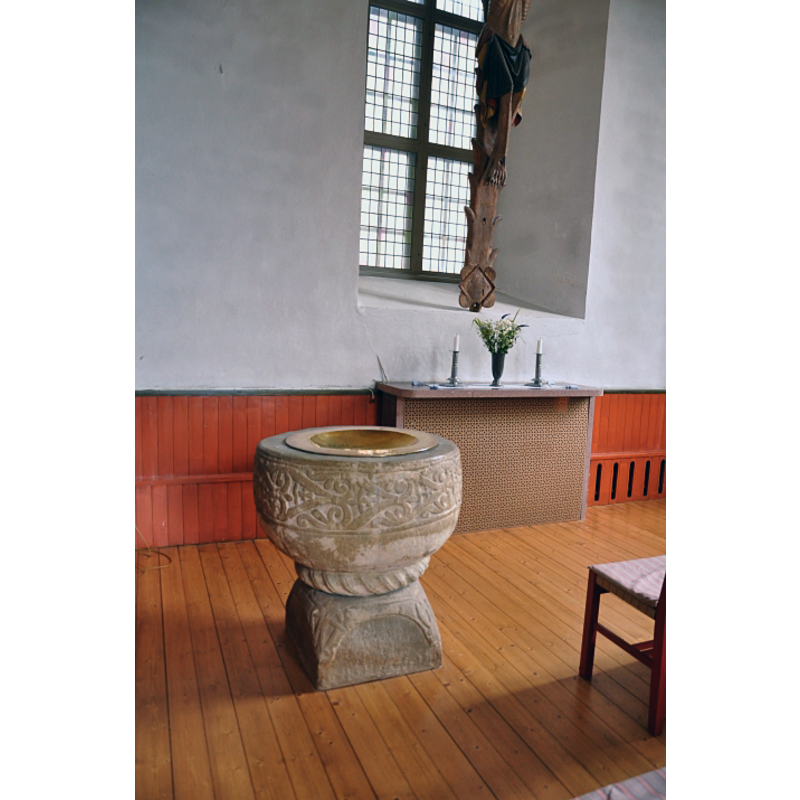 the replica copy of the medieval font in the context of the parish church interior