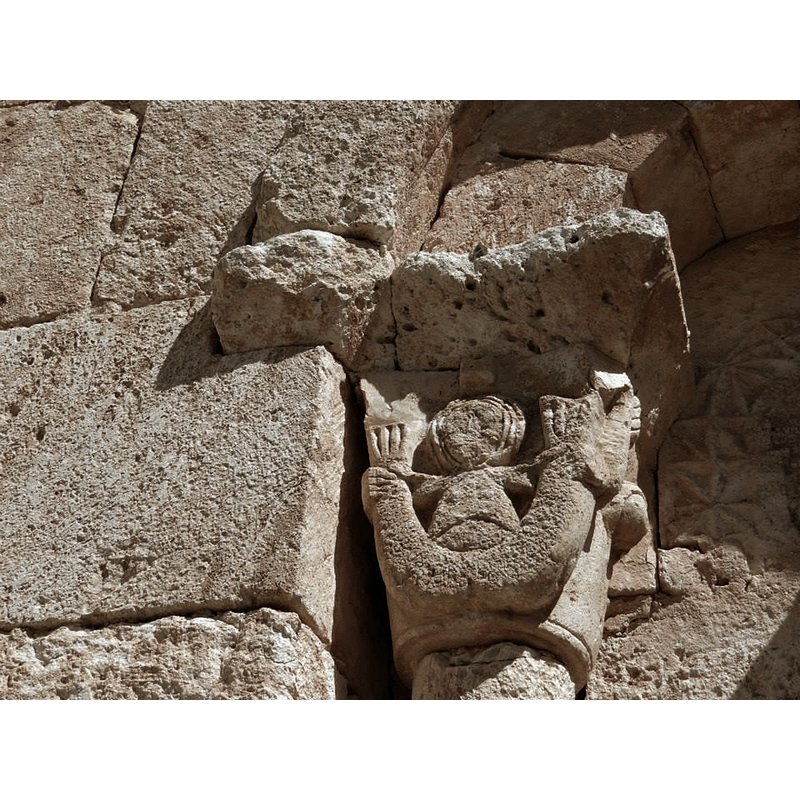 the siren holding its tails is also present in a capital of the apse and, inside the church, in one of the capitals of the chancel arch