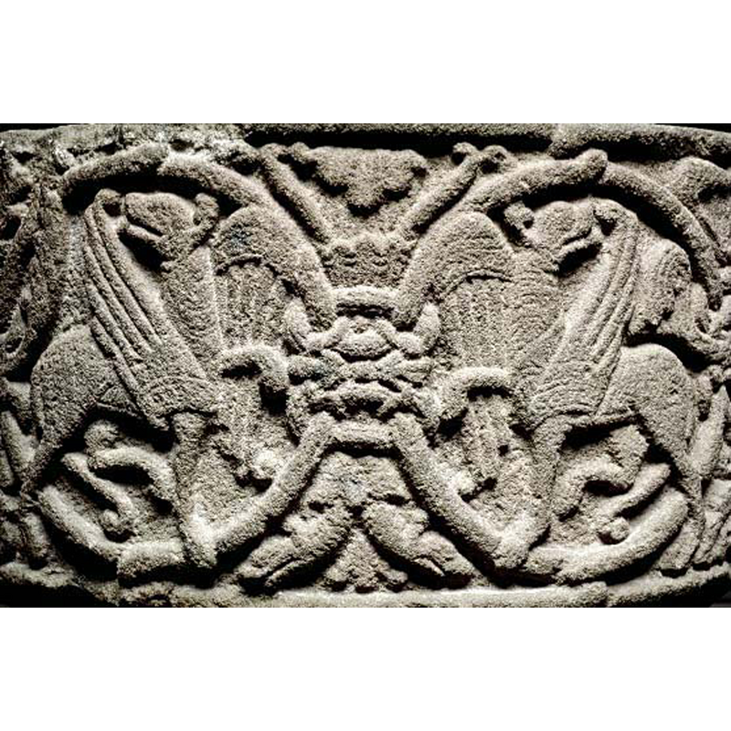 the SHM caption suggests "bevingade, motställda lejon" -- the bodies face each other, the heads in a 'regardant' pose