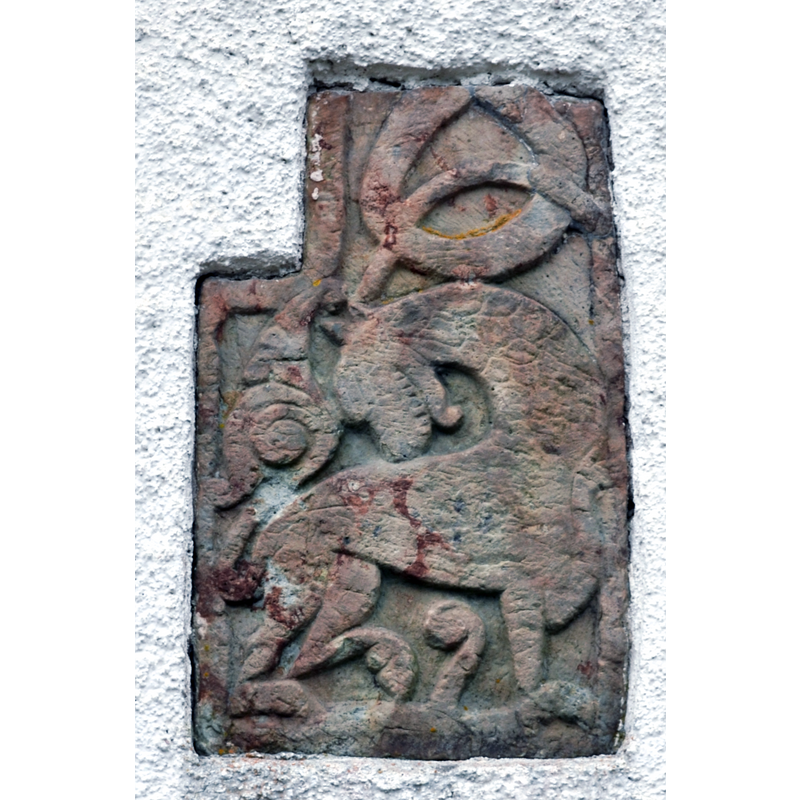 a sandstone relief from the original 12thC(?) churcfh, now mounted on the south wall of the south arm of the transept of the new church